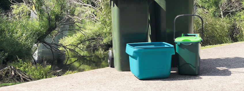 Image of the recycling crate and foodscraps bin on the river path
